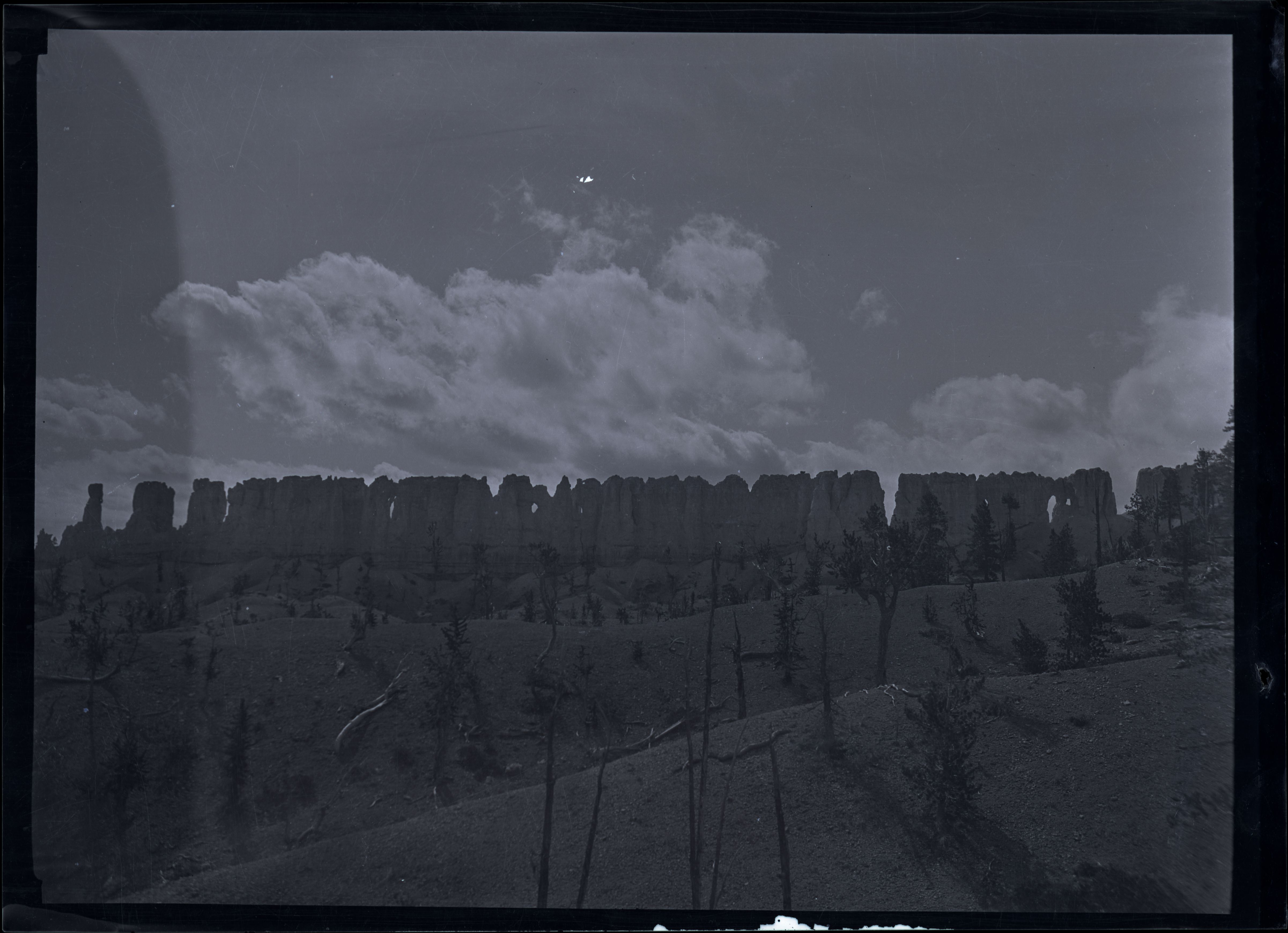 Historical black-and-white photograph of China Wall from Fairyland Loop, by Maurice Cope.