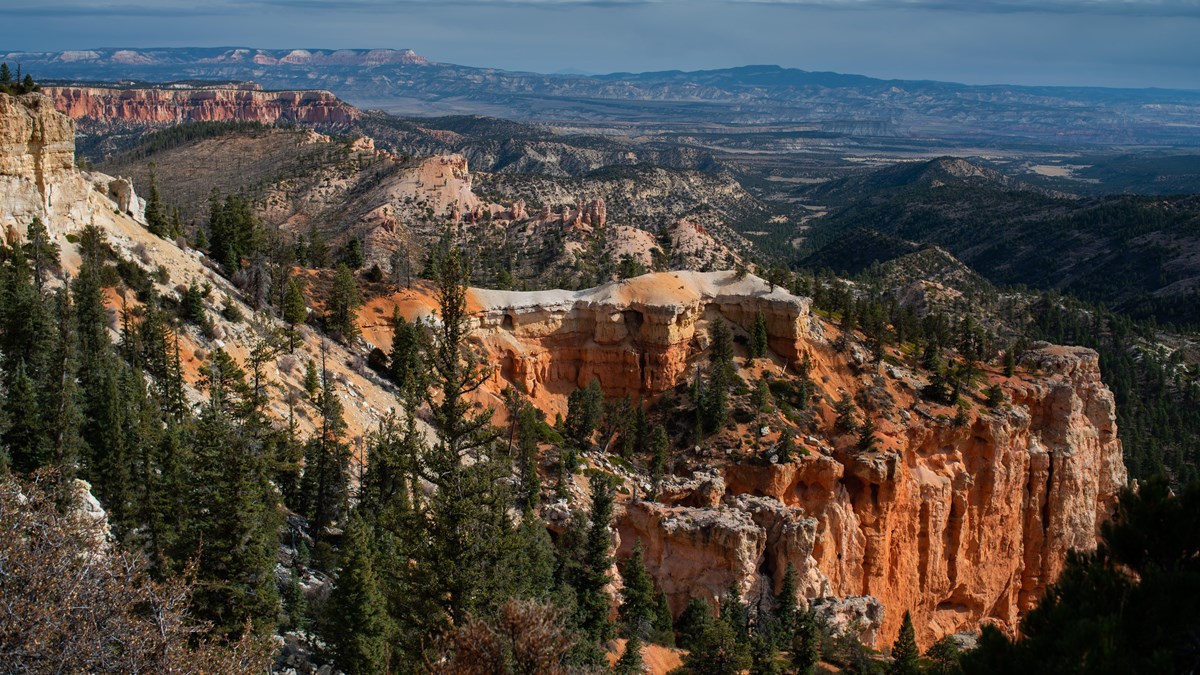 NPS landscape photograph at Farview Point: cliffs and wooded slopes.